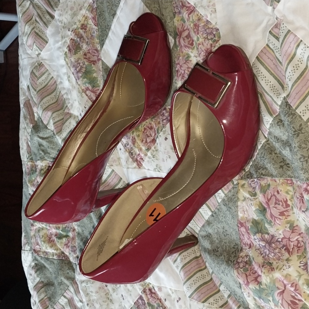 Bandolino red patent open toe pumps.